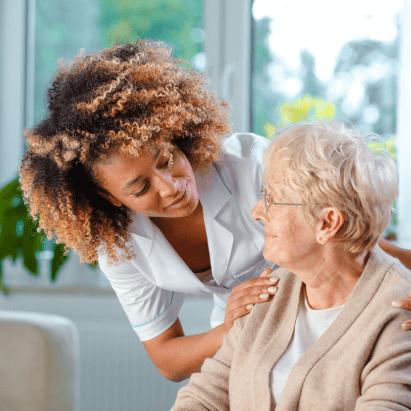 Caregiver helps resident patient